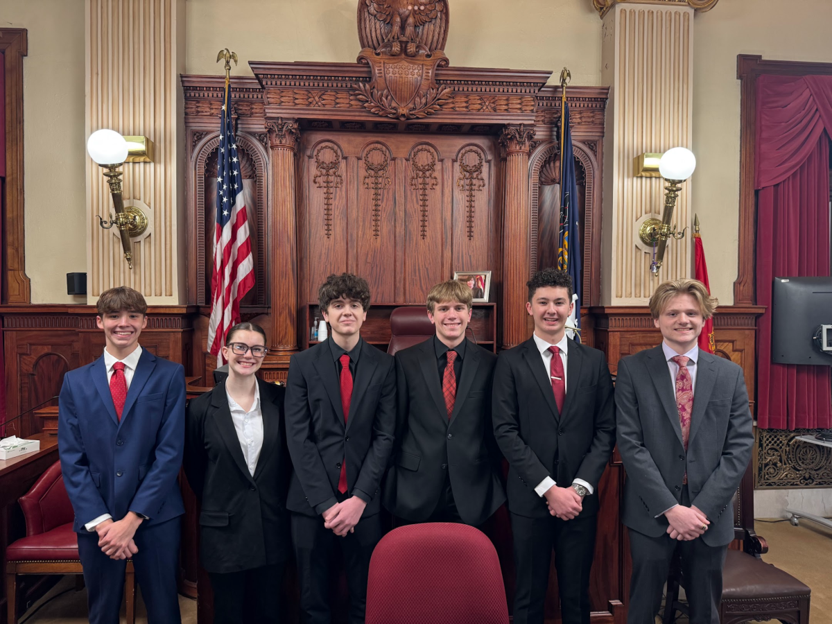 The prosecution team poses for a quick photo together after they presented their case to the jury. 