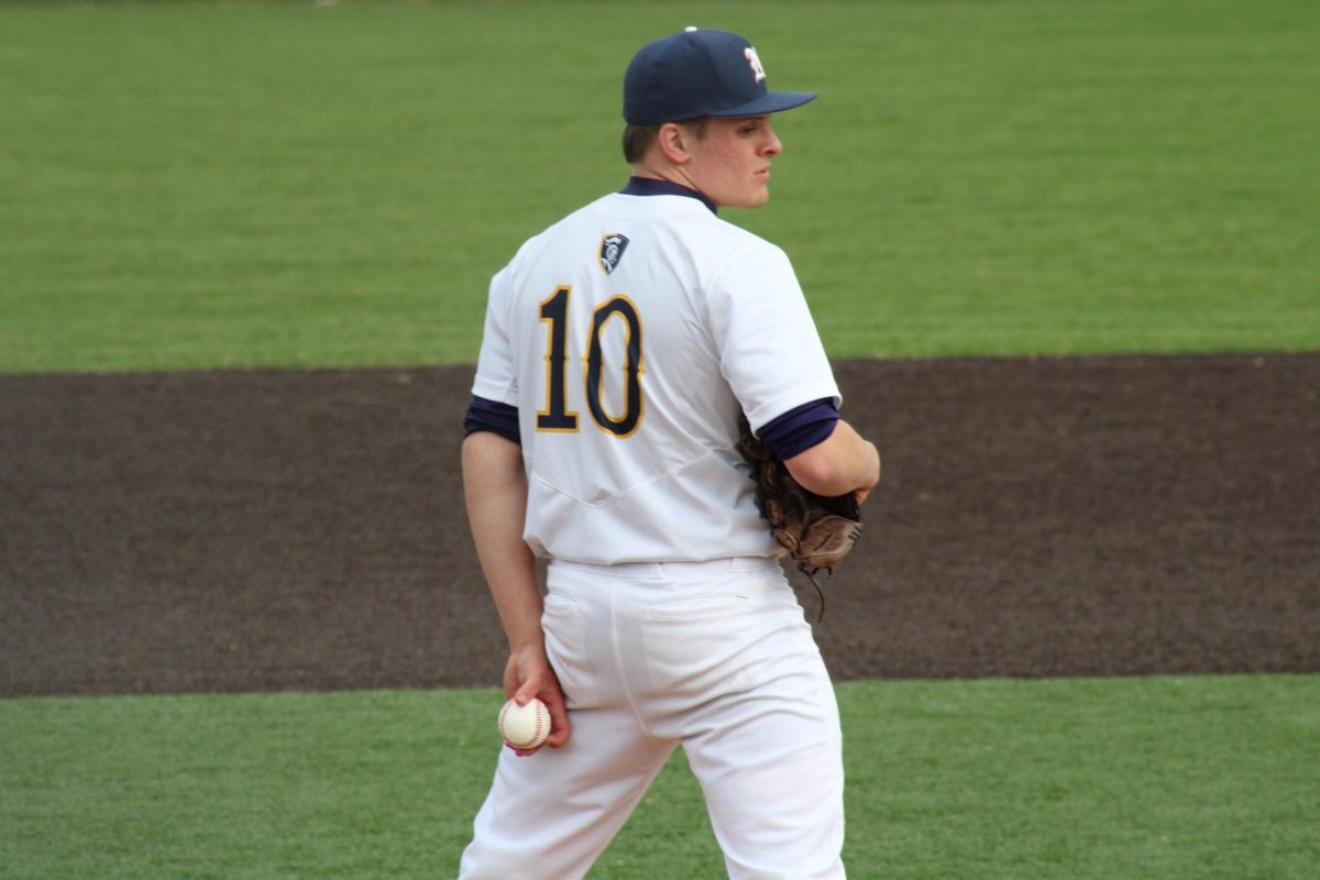 Senior pitcher Ethen Culbertson preparing to pitch on the mound