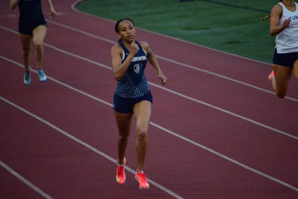 Mel Schmidt finishing her 400 meter dash at the Butler Invite.