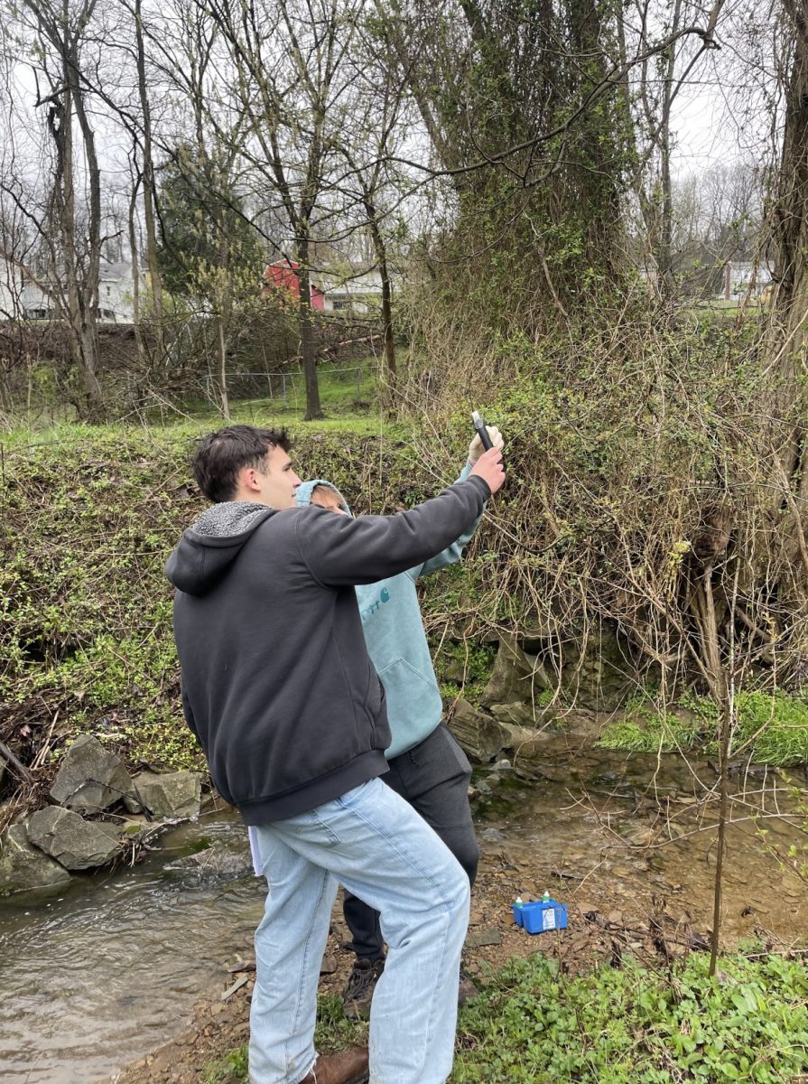 Joseph Cramer and Jonah Stashko measure pH.
