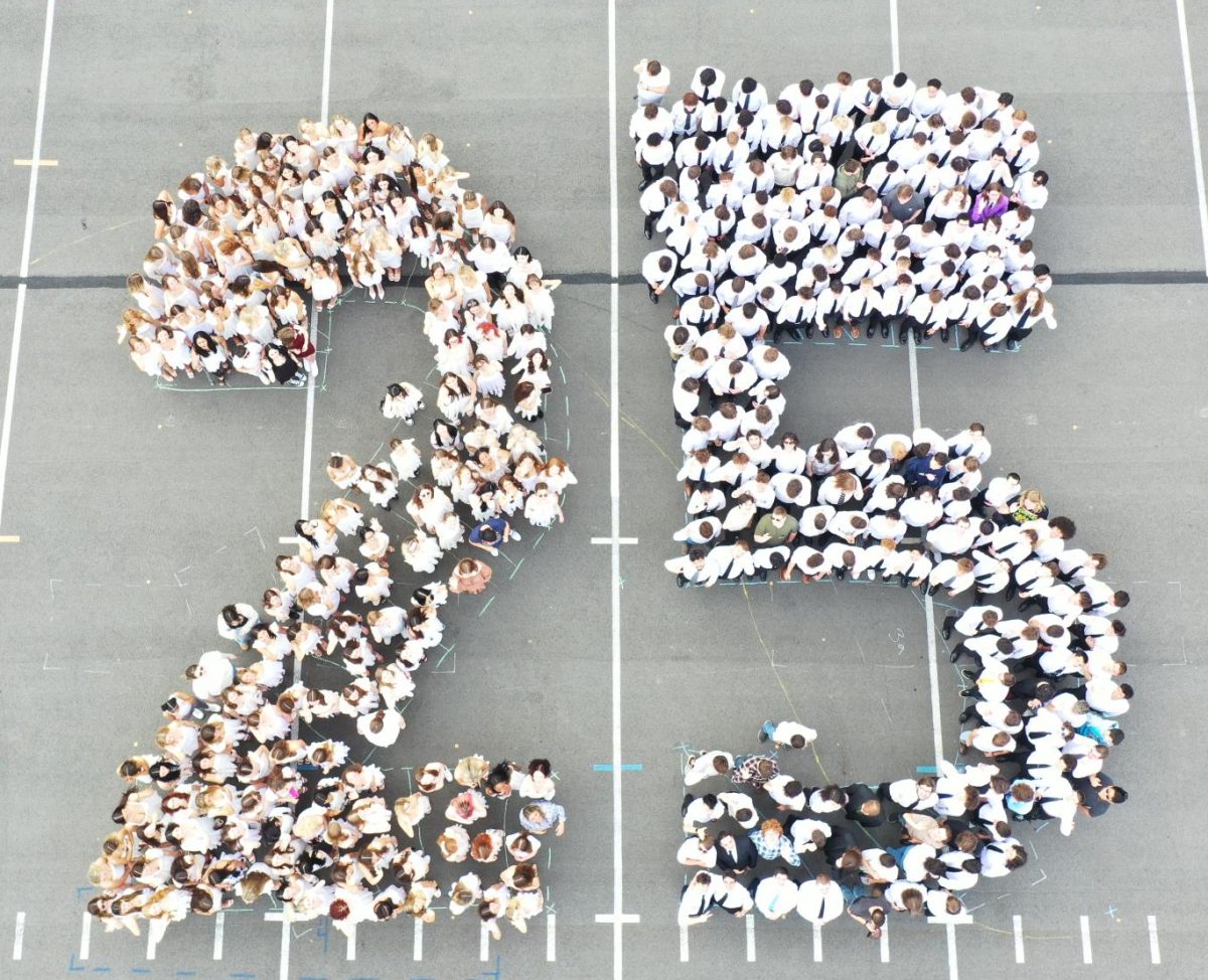Seniors pose on the bandfield on last day of school to commemorate the class of '25.