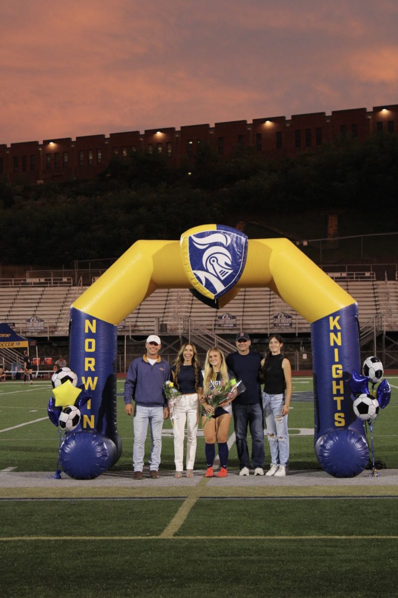 Senior, Nicole Bown, and her family on senior night.