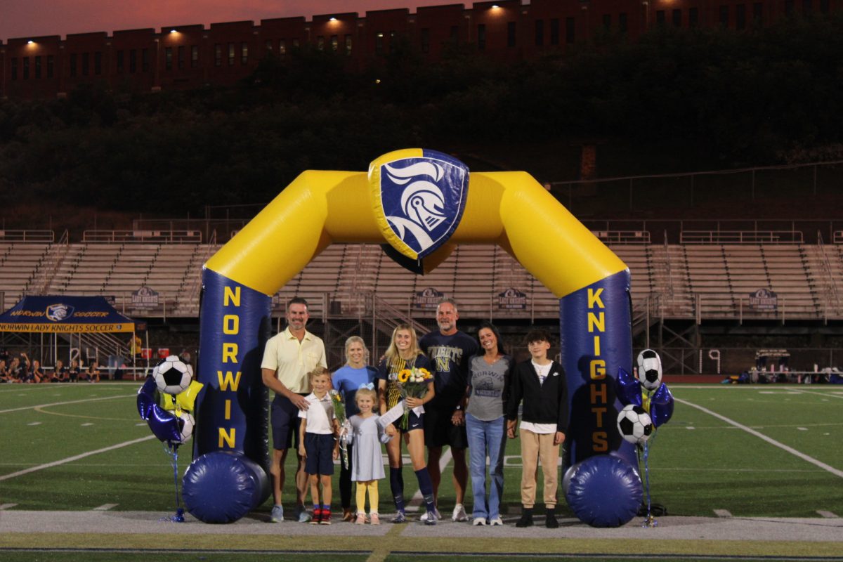 Senior, Gigi Fuschell, and her family on senior night.