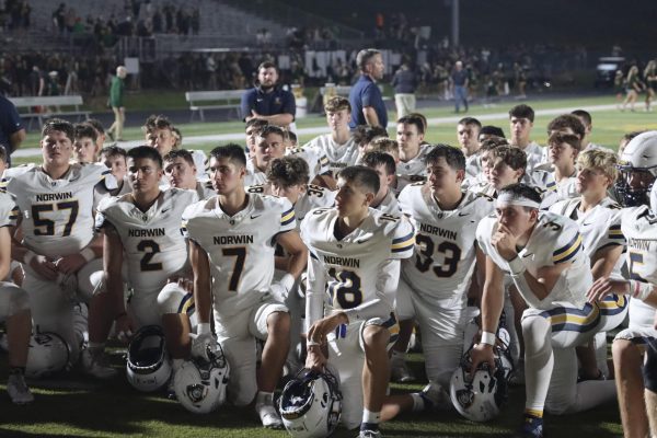 The Knights kneel before a game