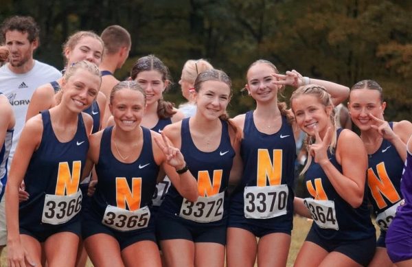 The Lady Knights pose before their race.
