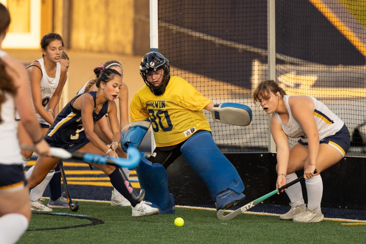Emma Heidinger (goalie) and Mia Douglas (right) and Sophia Laskowski (left)