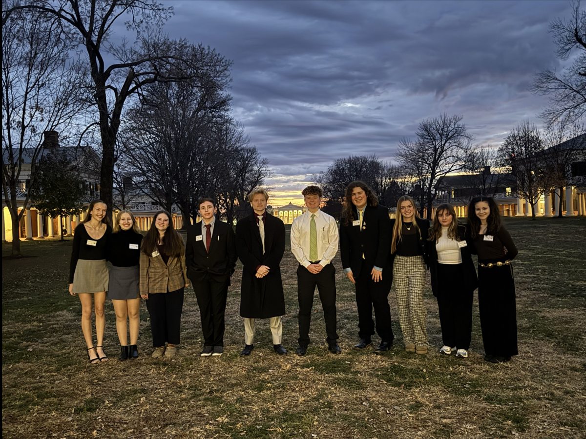 All of the students who attended UVA, with the sun setting on their time there.