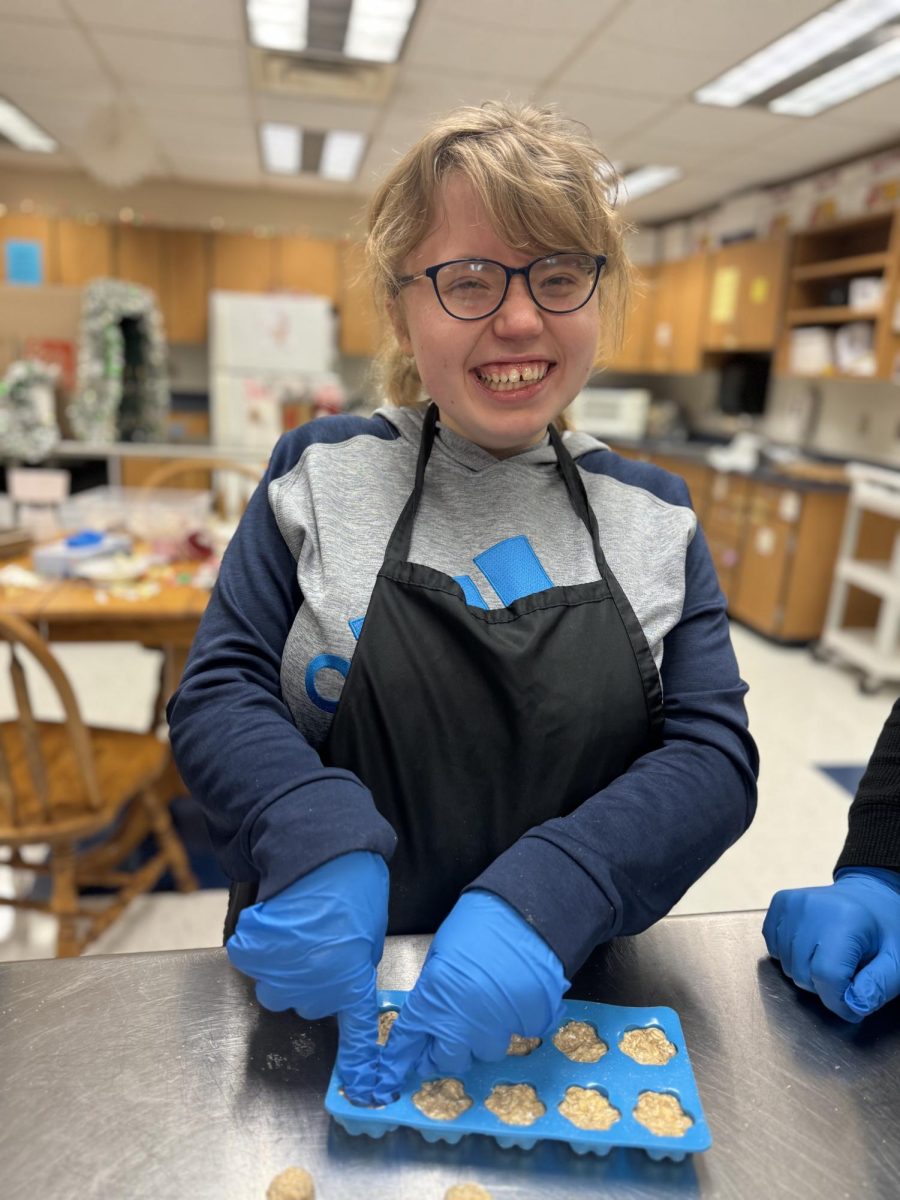 Erin McGuinness molds the dog treats 