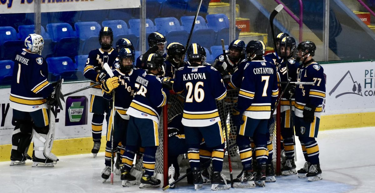The Knights huddle around their goal.