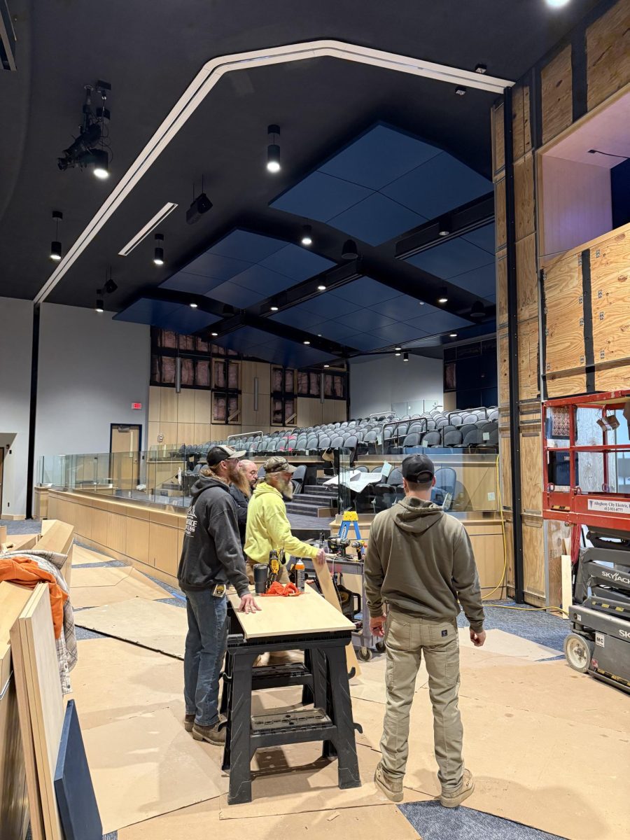 Construction workers in auditorium 