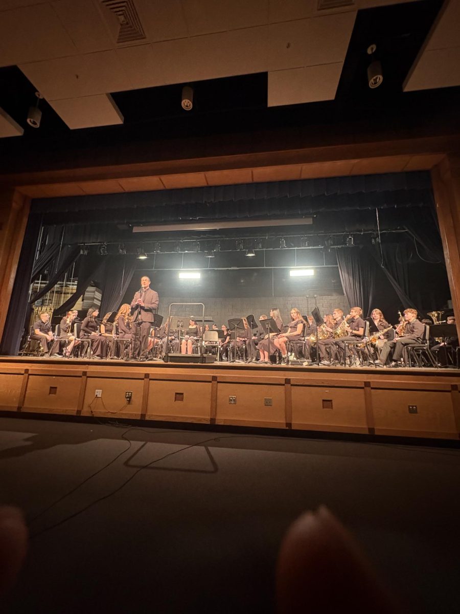 The Middle School 8th Grade band performing on stairs