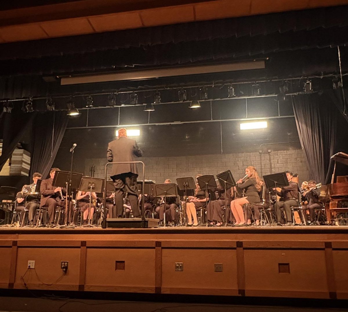 The Wind Ensemble performing on stage