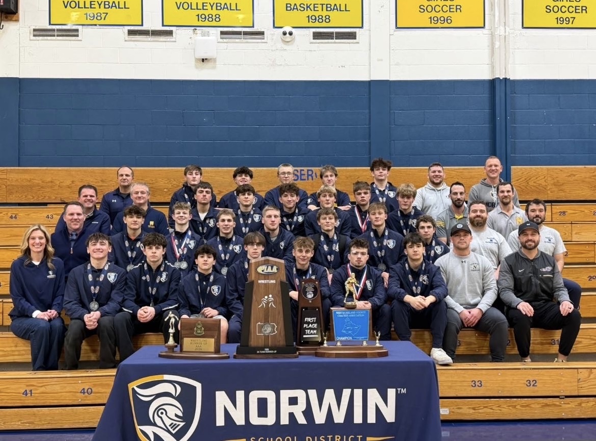 Norwin Boys Wrestling poses with their trophies