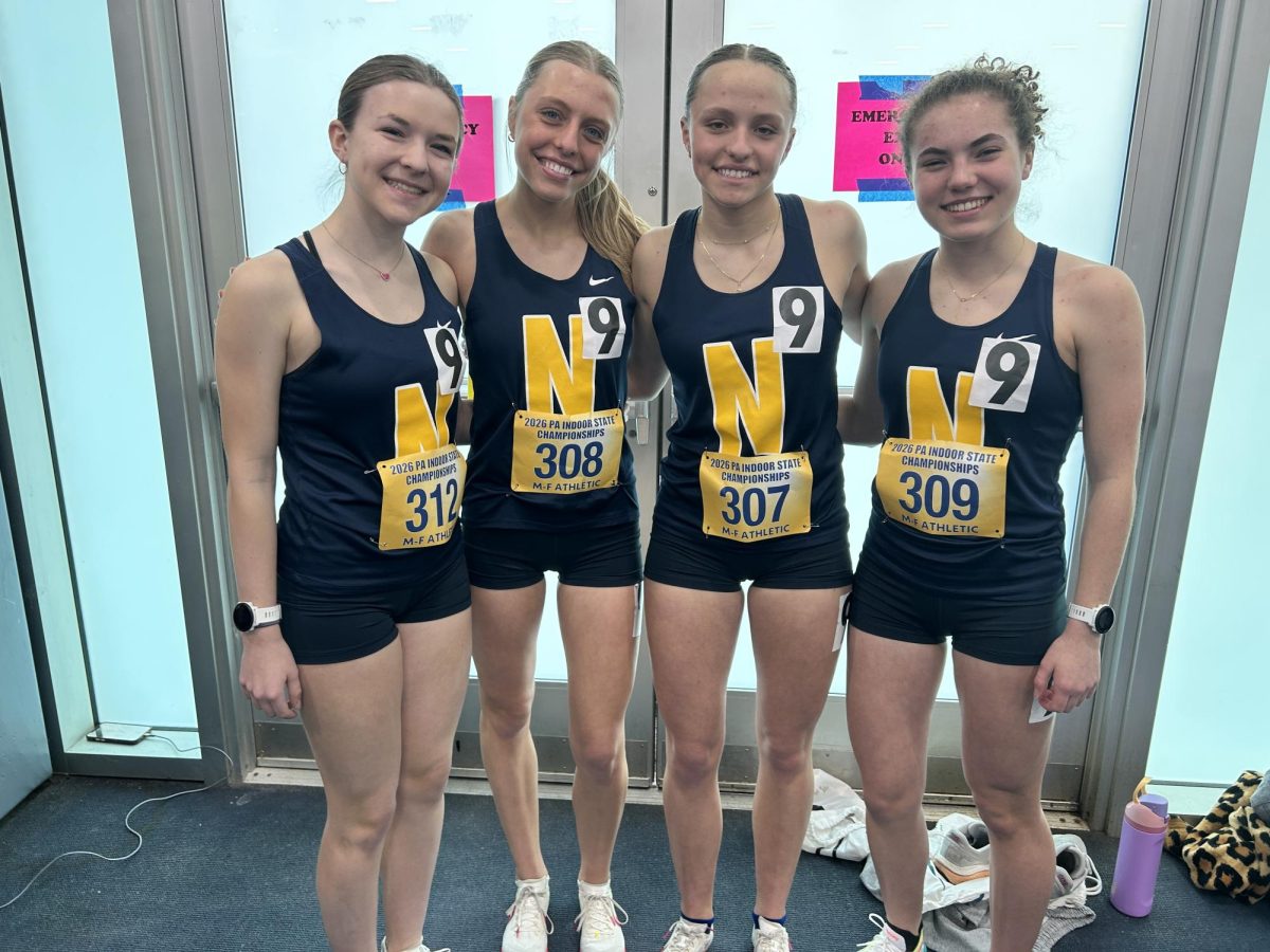 Juniors Jillian Ryba, Emily Dansak, Anna Dansak, and Addie Farrah pose with their 4 x 800 squad. The junior girls competed for second year in a row at state championship in the relay. 