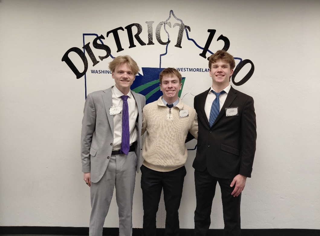 Roman Ola, Ryan Schoemer, and Maerek Moensens pose.